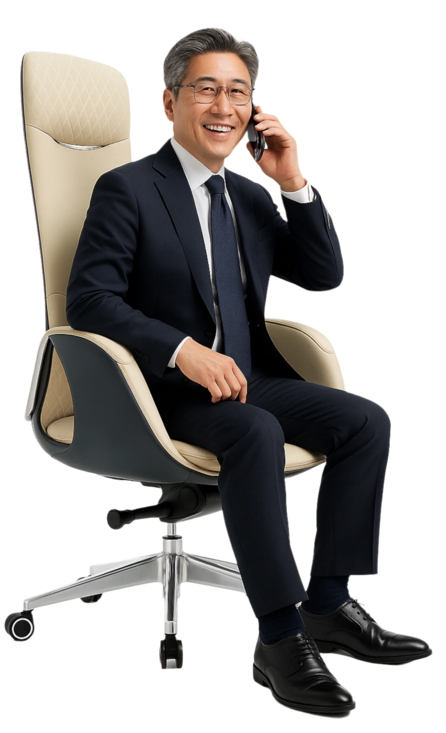 Man in a suit sitting on a high-back office chair, talking on a phone.