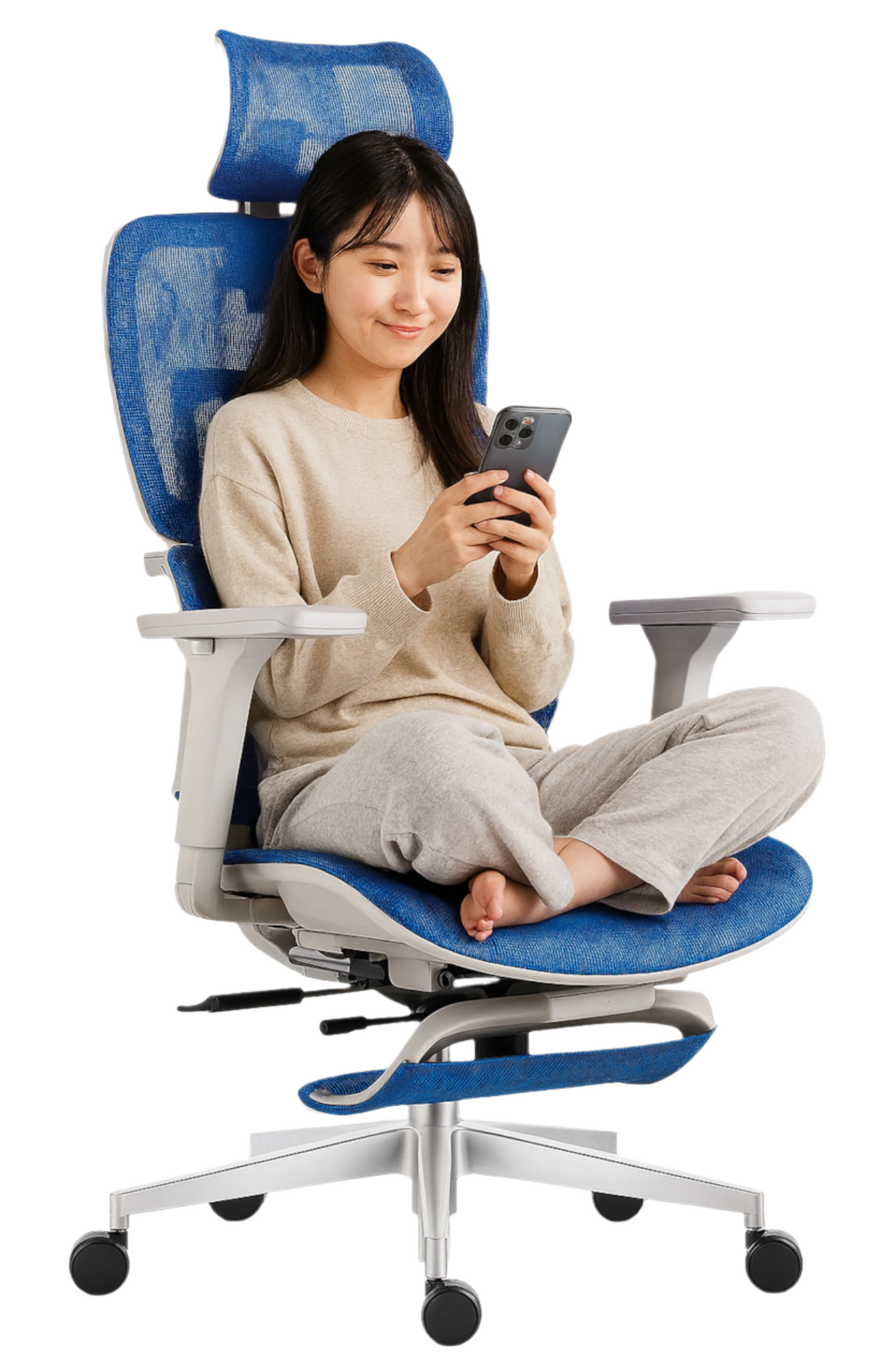 Woman using a smartphone while sitting on a blue office chair with a white background